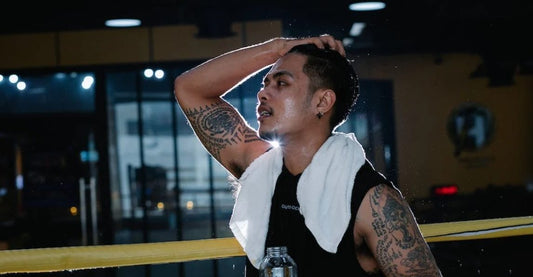 sweaty man after gym workoutgirl in gym clothes covering nose