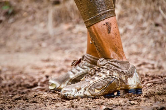 washing a dirty running shoewoman deodorizing a running shoe